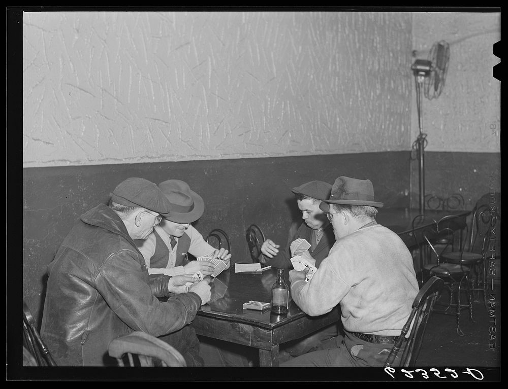 Card games are held nightly in neighborhood beer parlors. Ambridge, Pennsylvania. Sourced from the Library of Congress.
