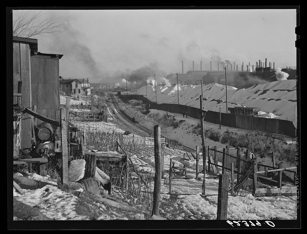 Backyards of company houses and steel mill. Midland, Pennsylvania. Sourced from the Library of Congress.