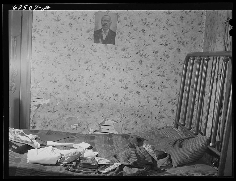 Bedroom in house in   district. Norfolk, Virginia. Sourced from the Library of Congress.