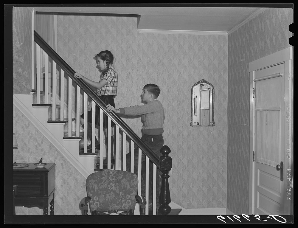Schulstad children going upstairs to bed. Aberdeen, South Dakota. Sourced from the Library of Congress.