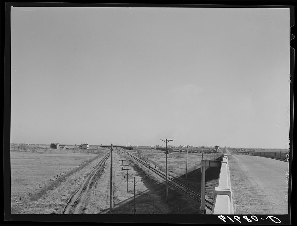 Country road, railroad, and highway leading into Groton, South Dakota. Sourced from the Library of Congress.