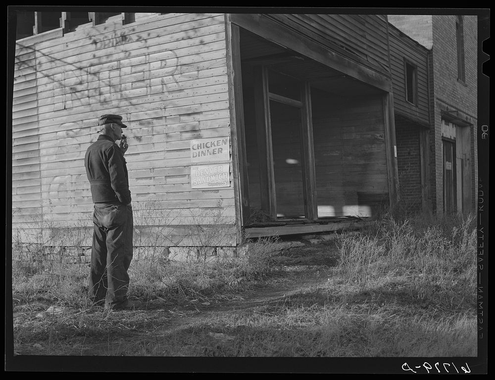 Old storekeeper and abandoned store in near ghost town. Shaw, Kansas. Sourced from the Library of Congress.