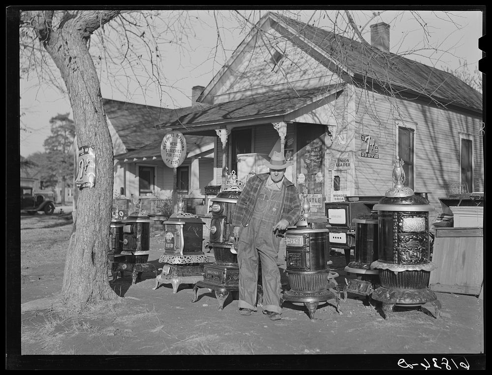 Man who operates small grocery store and secondhand furniture store in his home. Chanute, Kansas. Sourced from the Library…