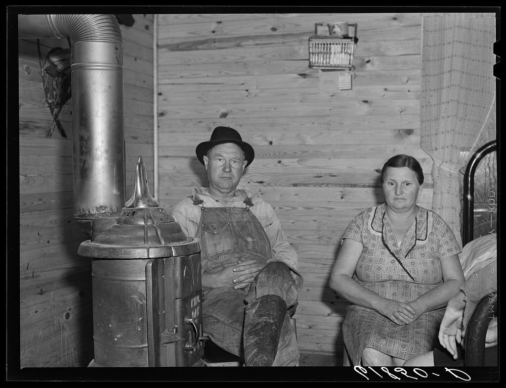 [Untitled photo, possibly related to: Agricultural day laborer, wife and daughter in new home built by FSA (Farm Security…