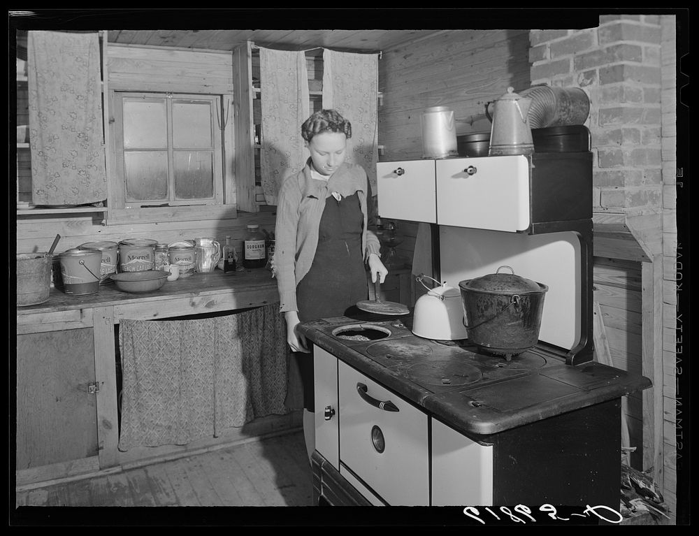 Kitchen in one of the scattered labor homes built by FSA (Farm Security Administration) at a cost of five hundred dollars.…