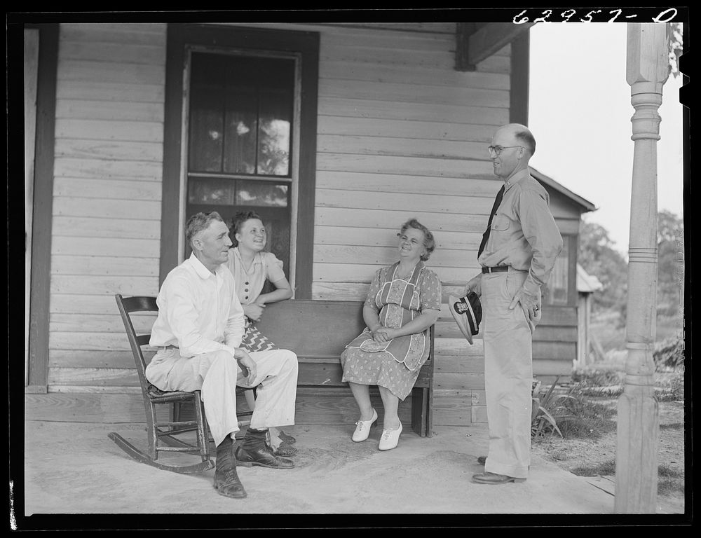 Lieutenant Sedgewick of United States Navy talking with Luther Corbin and his family. Martin County, Indiana. Sourced from…