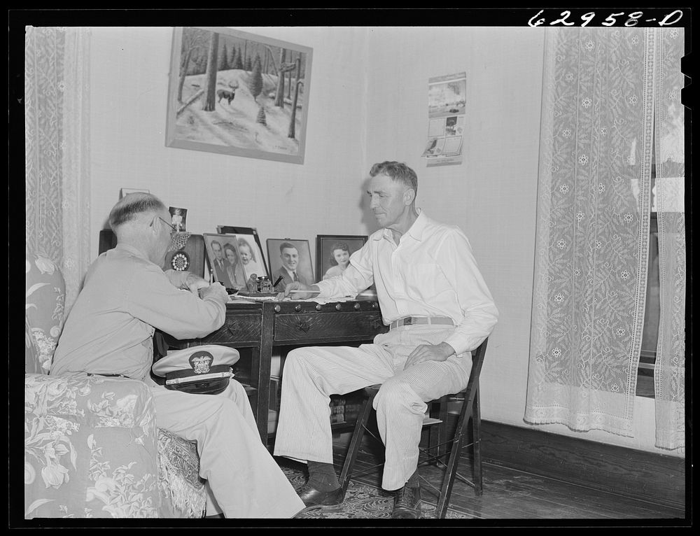 Lieutenant Sedgewick of United States Navy discussing acquisition of land with Luther Corbin. Martin County, Indiana farmer.…