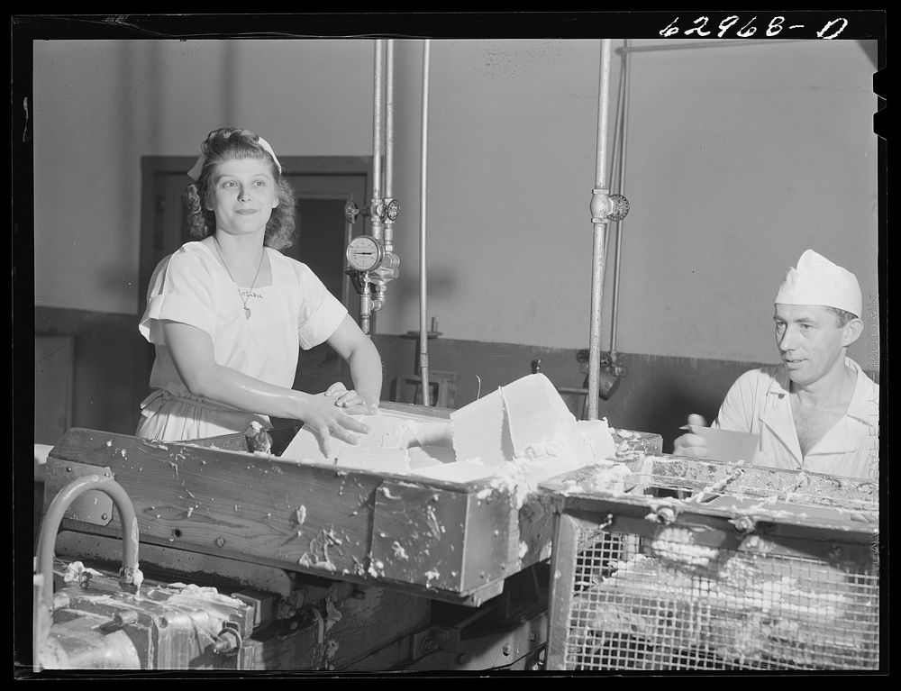 Preparing butter for packaging. Land O'Lakes plant, Chicago, Illinois. Sourced from the Library of Congress.