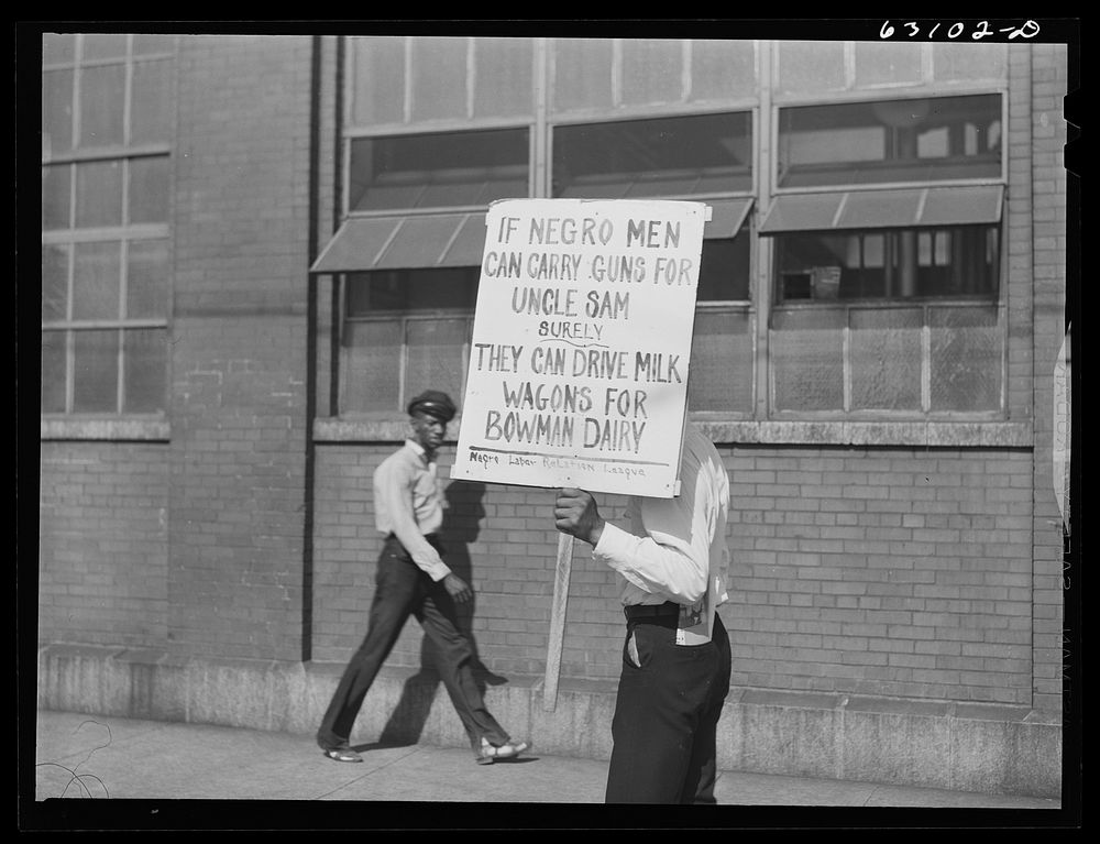 [Untitled photo, possibly realted to:  carrying sign in front of milk company. Chicago, Illinois]. Sourced from the Library…