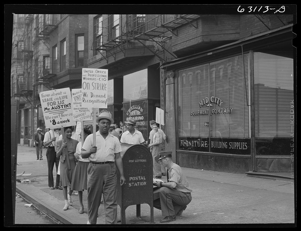 Picket line in front of Mid-City Realty Company. South Chicago, Illinois. Sourced from the Library of Congress.