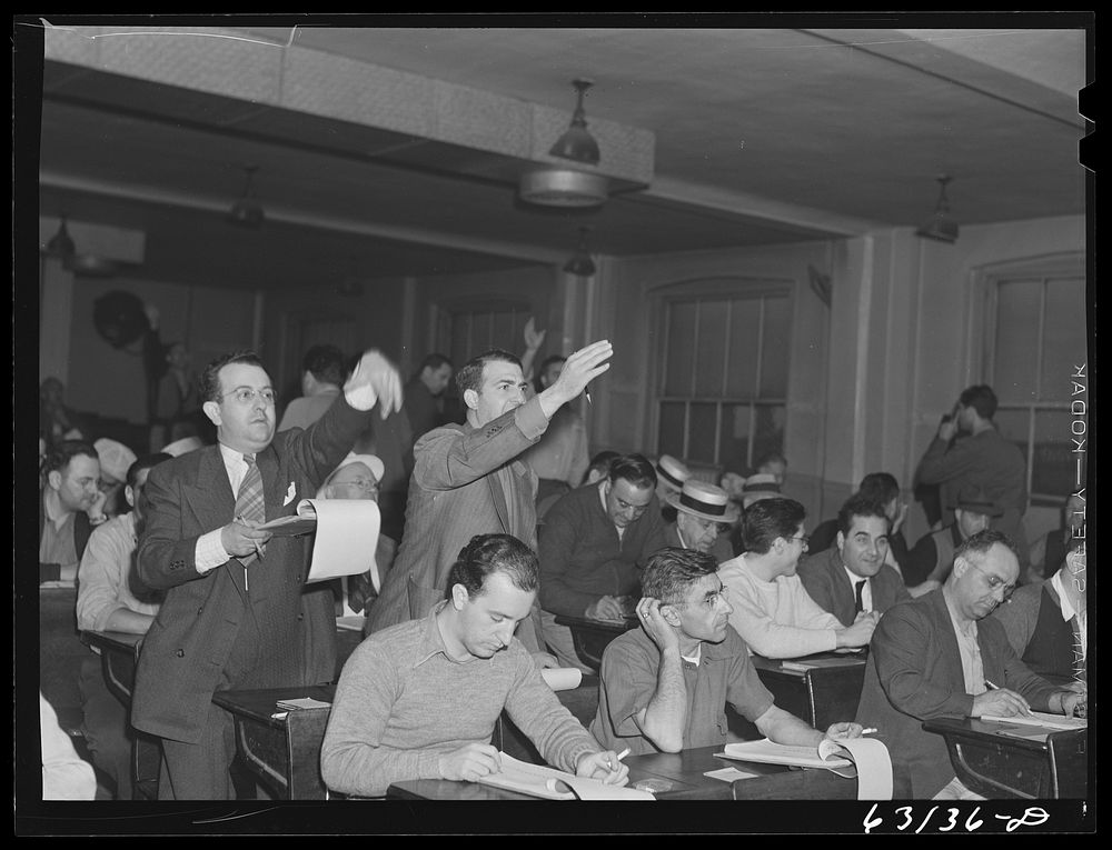 Commission merchants and their agents at early morning auction at fruit terminal, Chicago, Illinois. Auctions are held every…