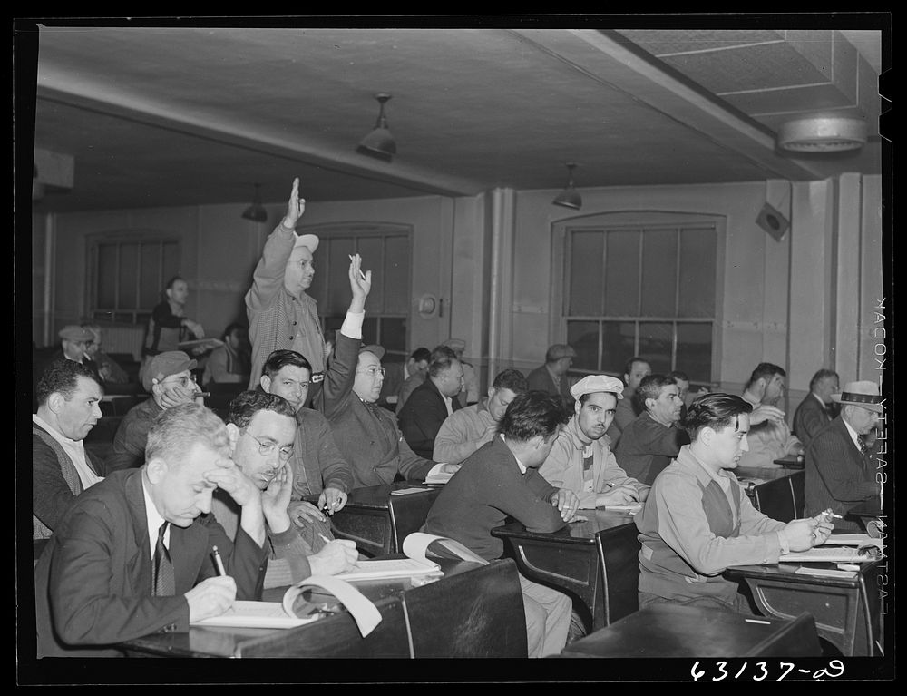 Commission merchants and their agents at early morning auction at fruit terminal, Chicago, Illinois. Auctions are held every…