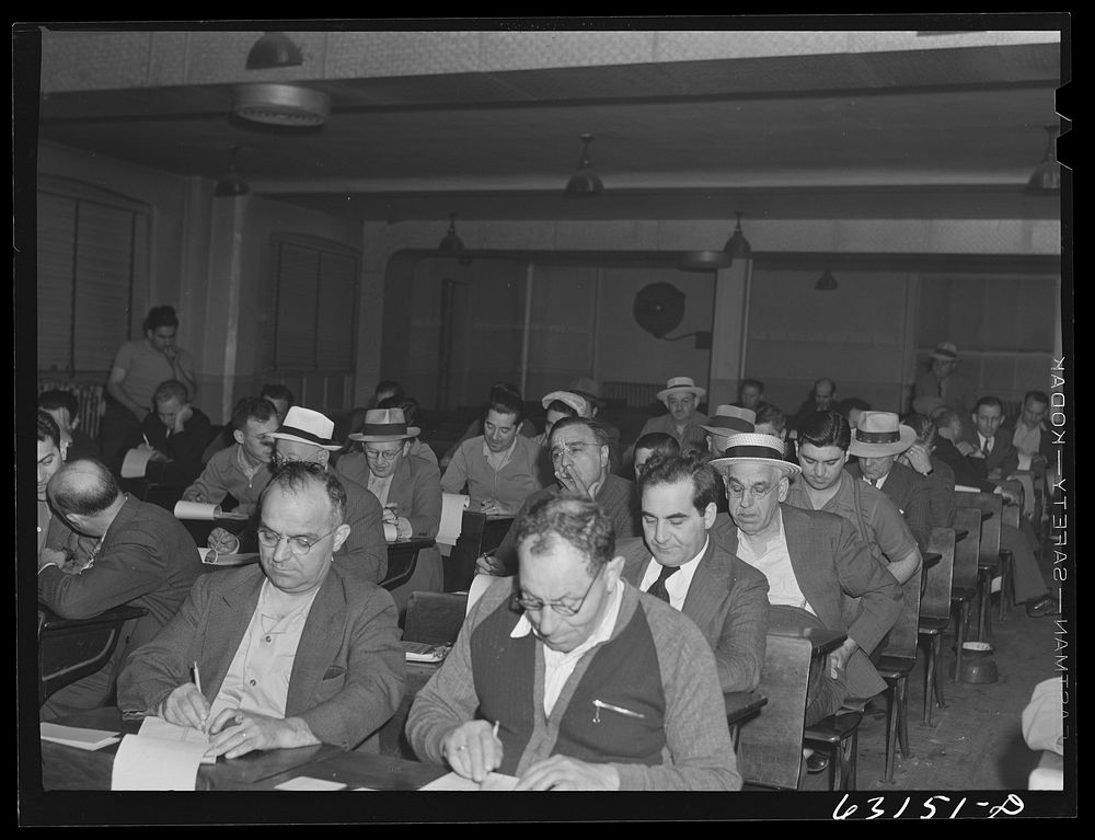 Commission merchants and their agents at early morning auction at fruit terminal. Chicago, Illinois. Auctions are held daily…