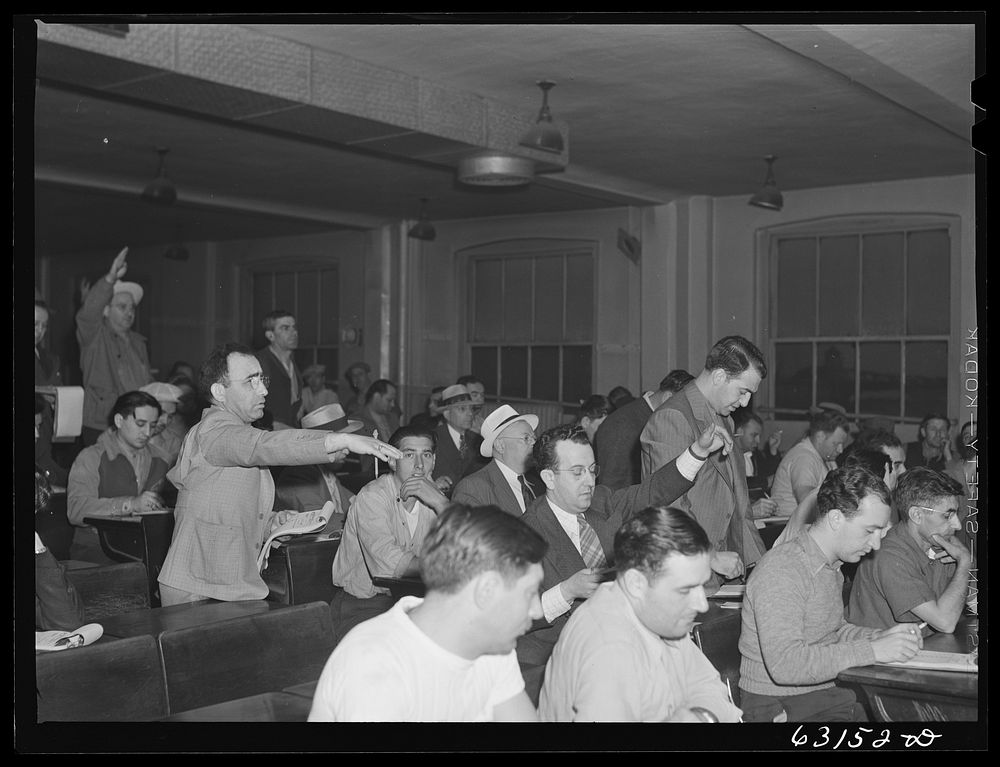 Commission merchants and their agents at early morning auction at fruit terminal. Chicago, Illinois. Auctions are held daily…