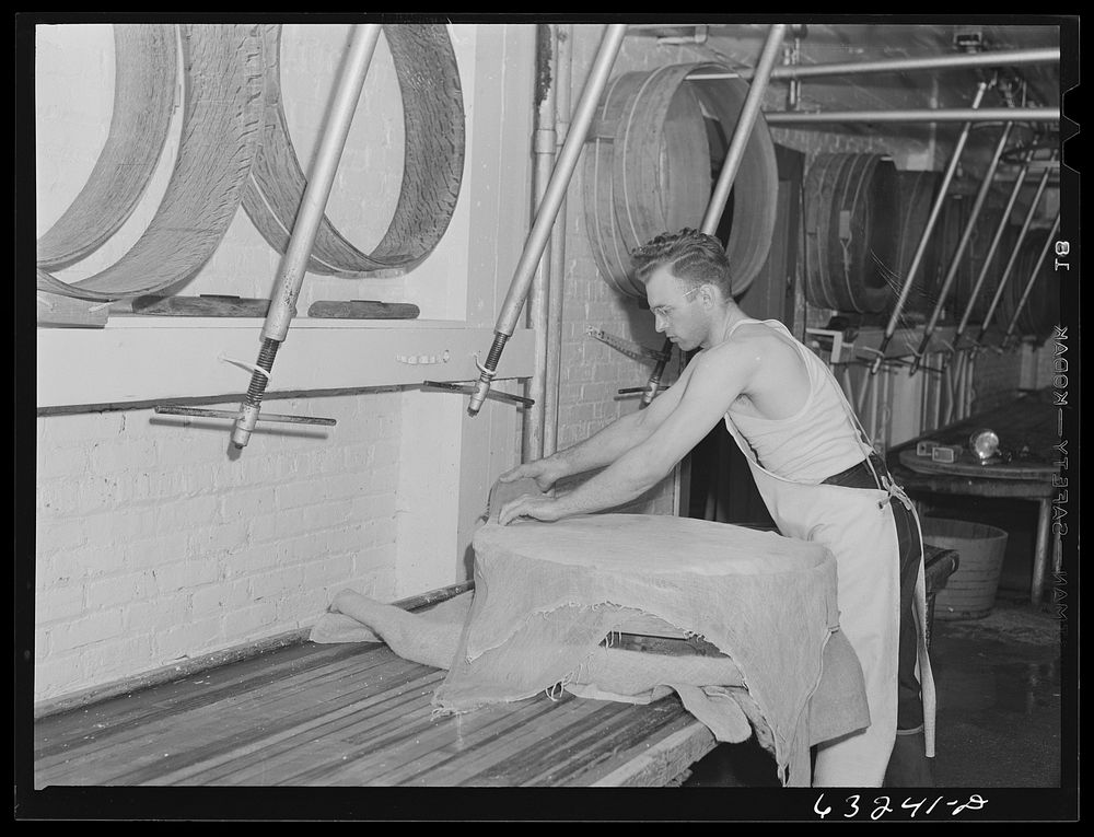 Placing cheese cloth over the curd. Swiss cheese factory. Madison, Wisconsin. Sourced from the Library of Congress.