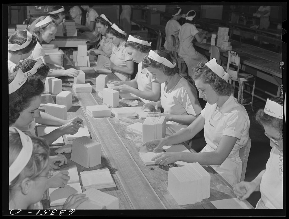 Packing butter cut into squares for use in restaurants. Land O'Lakes plant, Minneapolis, Minnesota. Sourced from the Library…