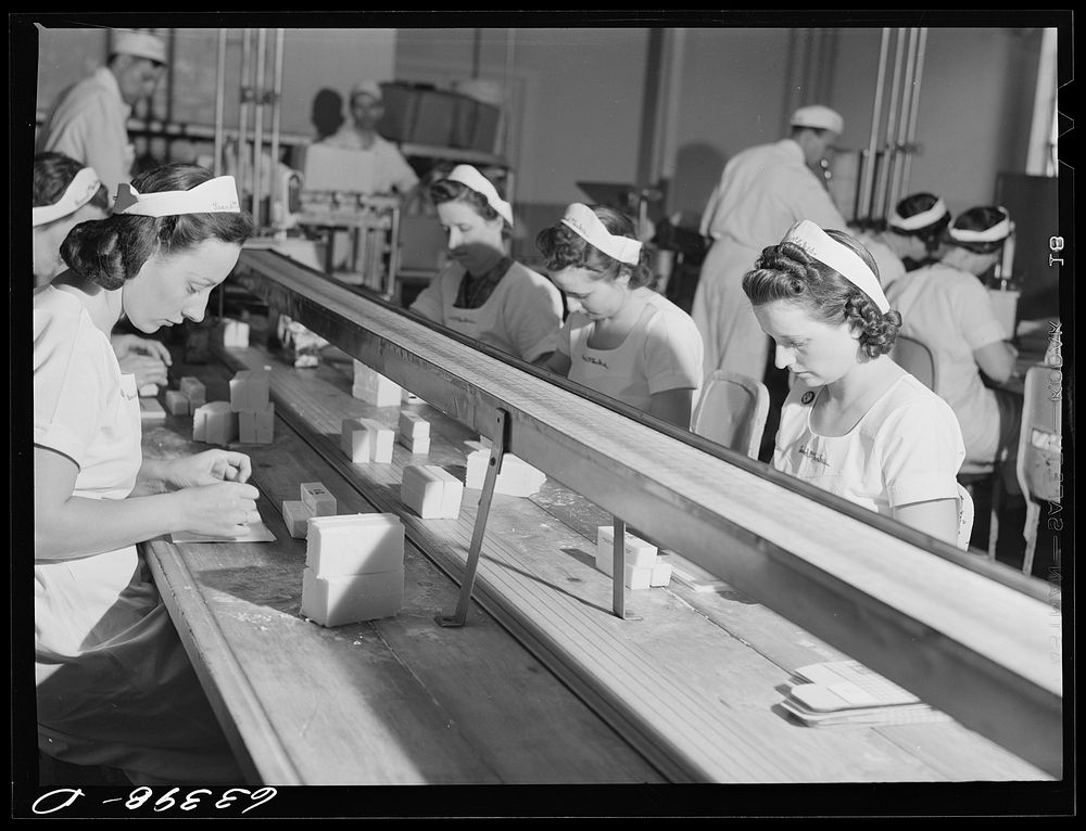 [Untitled photo, possibly related to: Packing butter cut into squares for use in restaurants. Land O'Lakes plant…
