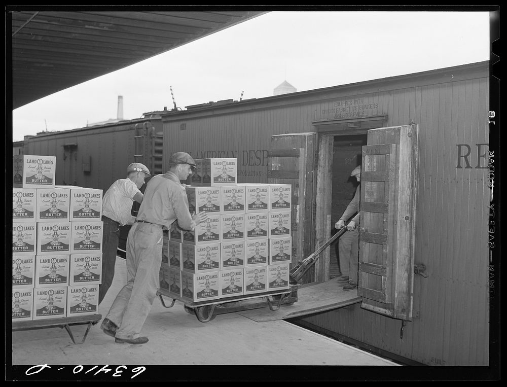 Loading packaged butter onto freight car. Land O'Lakes plant, Minneapolis, Minnesota. Sourced from the Library of Congress.