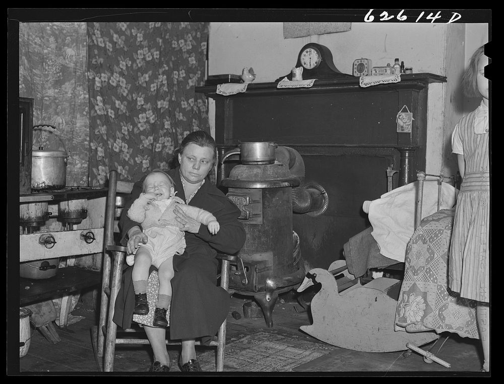 Mother and child of destitute family of five living in one room at Helping Hand Mission. Portsmouth, Virginia. Sourced from…