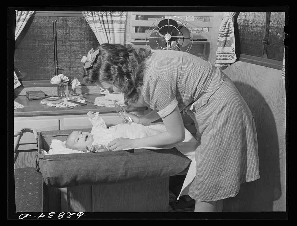 [Untitled photo, possibly related to: Wife and child of worker at General Electric plant in trailer home at FSA (Farm…