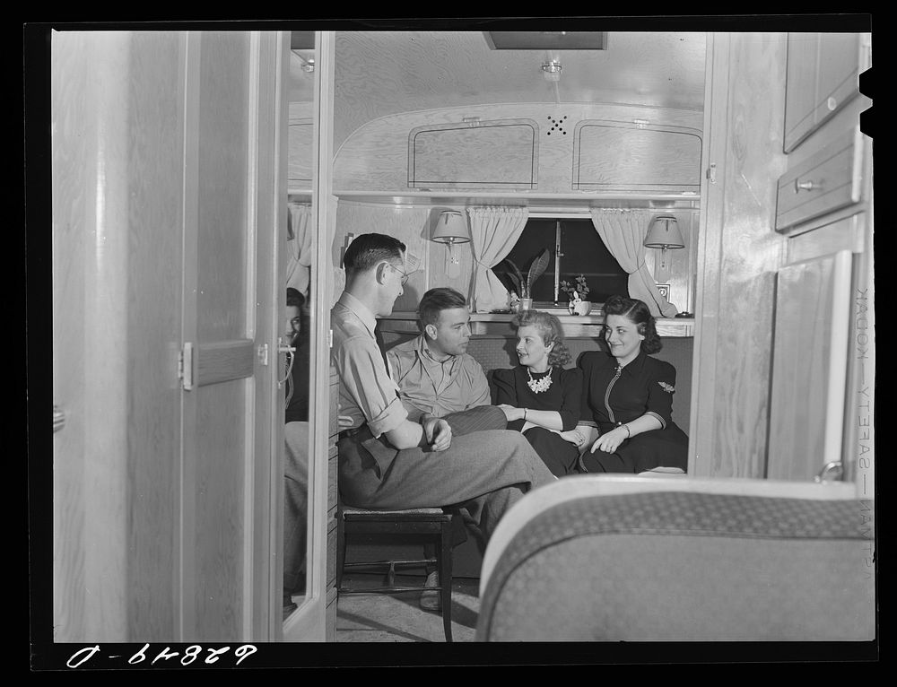 [Untitled photo, possibly related to: Evening visitors at the trailer of Milton B. Ackerman, FSA (Farm Security…