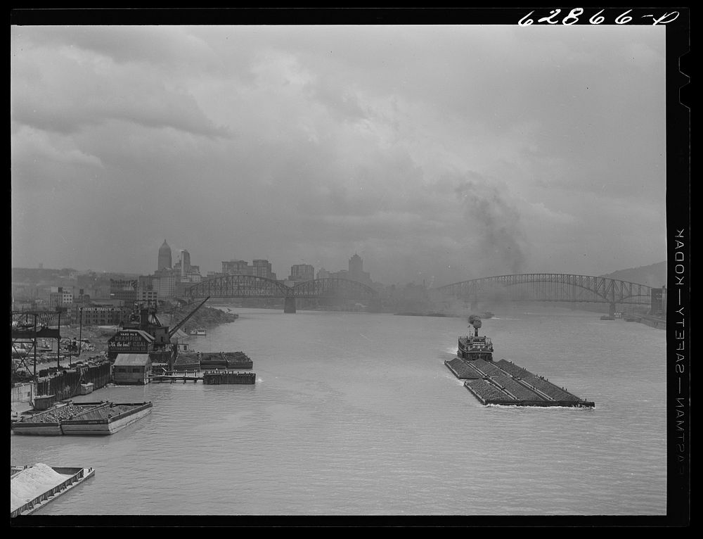 Coal barges on the river. Pittsburgh, Pennsylvania. Sourced from the Library of Congress.