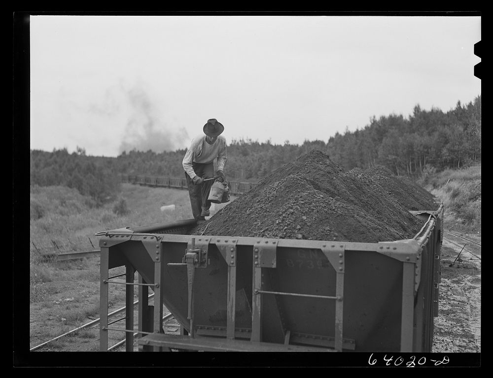 Taking sample of iron ore before it leaves the concentration plant. Bovey, Minnesota. Sourced from the Library of Congress.