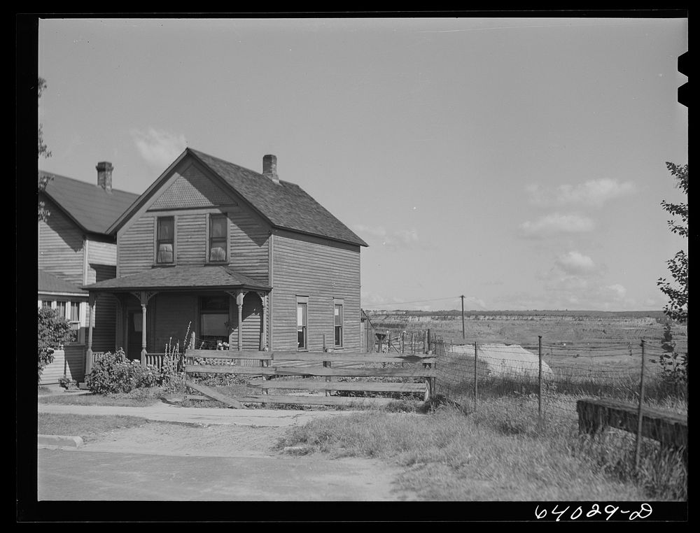 [Untitled photo, possibly related to: House in North Hibbing, Minnesota on the edge of the world's largest open pit iron…