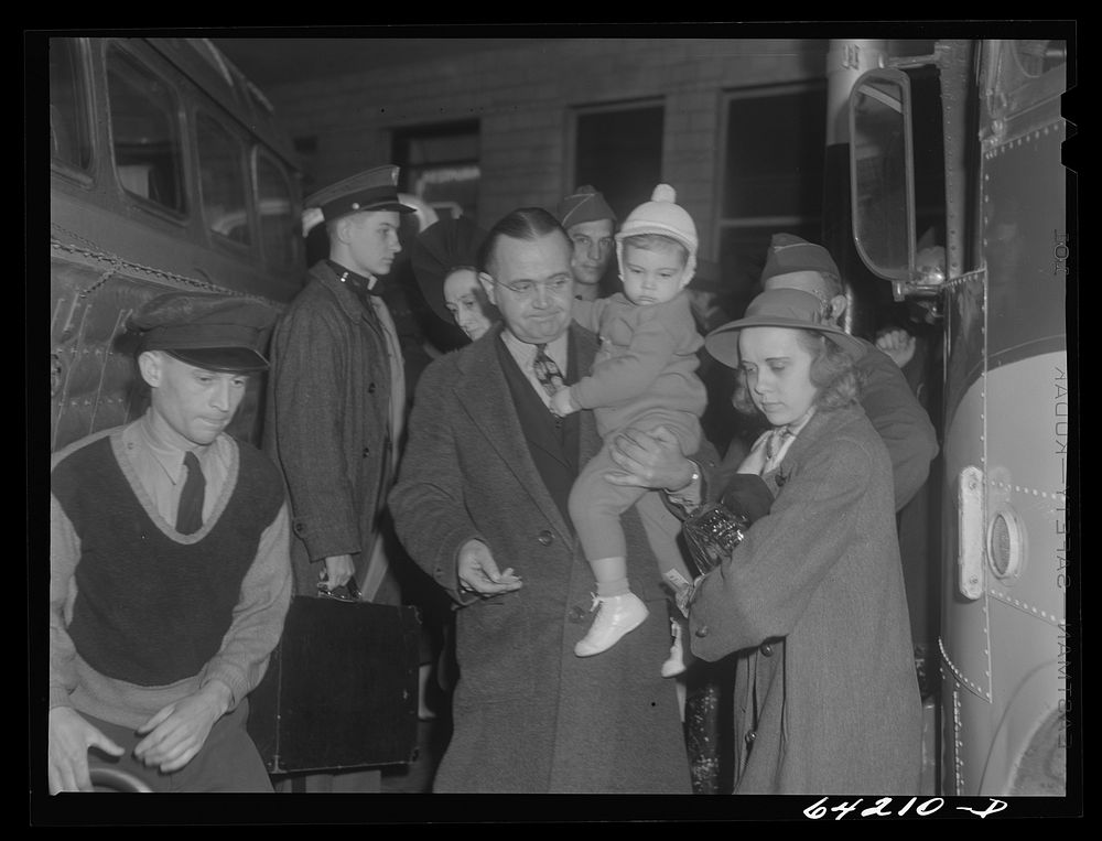 Washington, D.C. Greyhound bus terminal on the day before Christmas. Passengers getting off a bus which has arrived at the…