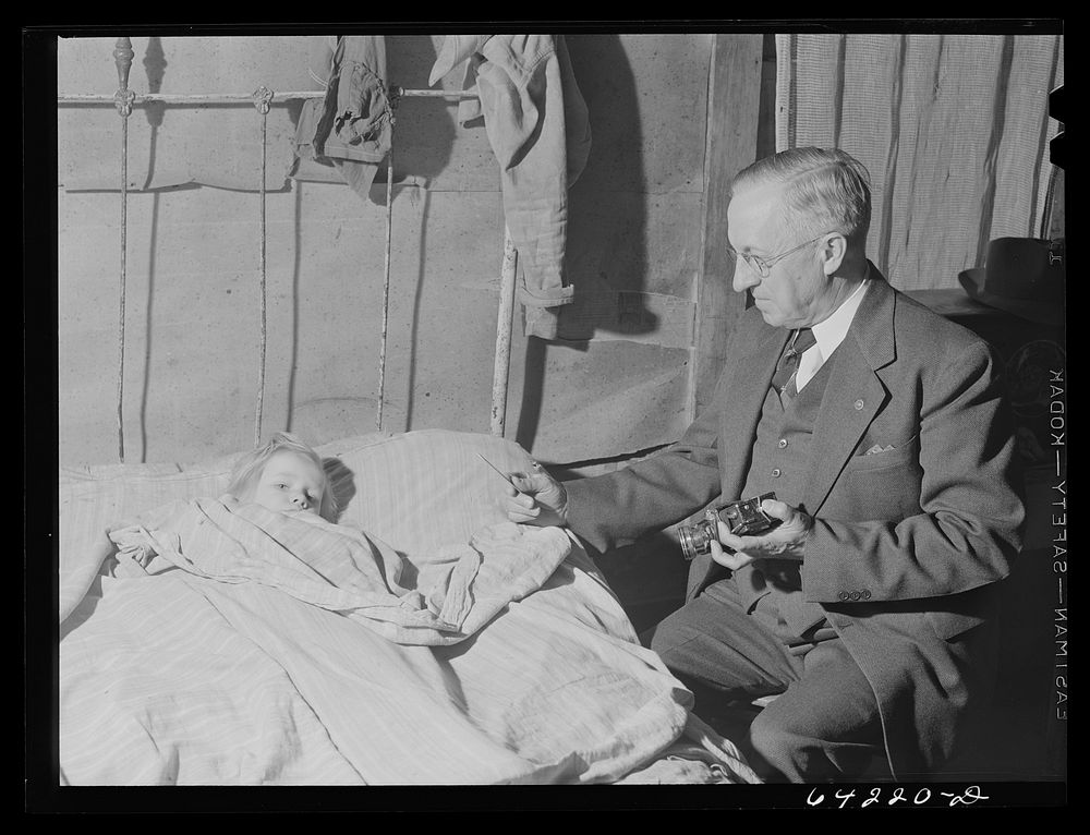 Scott County, Missouri. Doctor at bedside of sick child. Sourced from the Library of Congress.