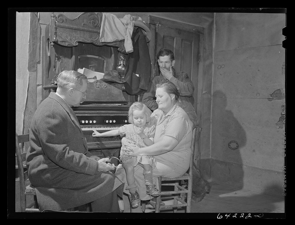 [Untitled photo, possibly related to: Scott County, Missouri. Doctor visits sick child at home]. Sourced from the Library of…