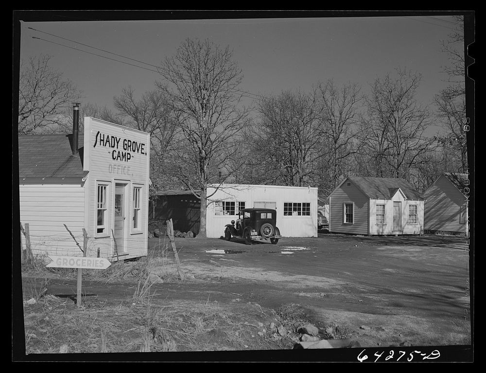 [Untitled photo, possibly related to: Newton County, Missouri. Camp Crowder area. Tents, trailers and cabins stretch along…