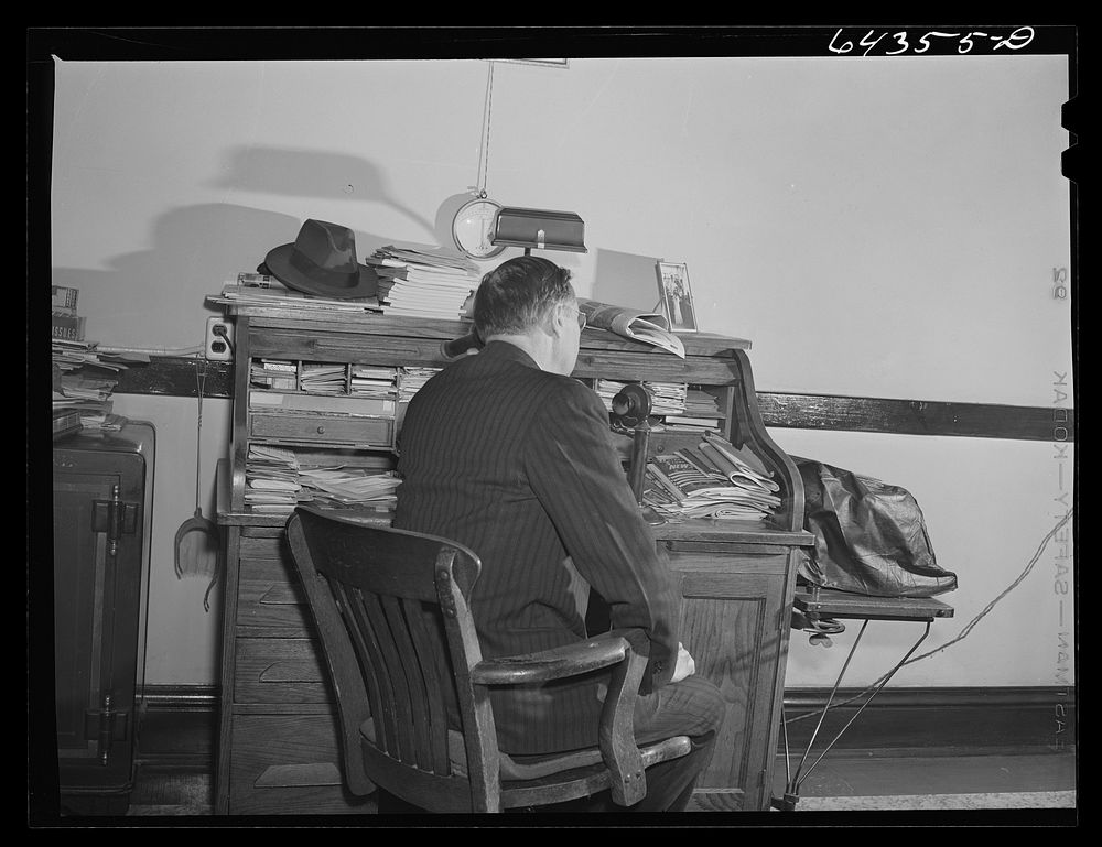 Oran, Missouri. Doctor receiving call in his office. Sourced from the Library of Congress.