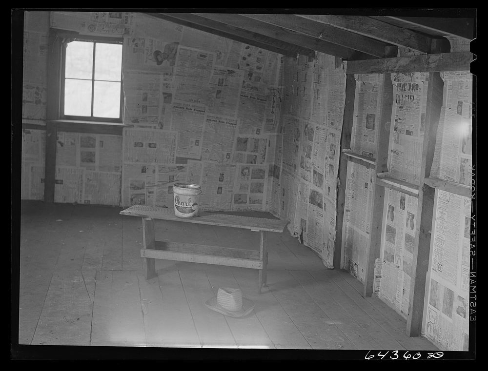 Newton County, Missouri. Camp Crowder area. Inside an abandoned house in the Ozarks. The Army has bought this land for…