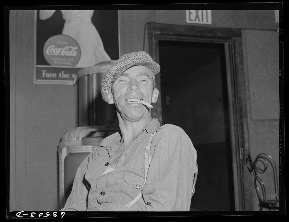 Farm worker in beer parlor on Sunday afternoon. Bruce Crossing, Michigan. Sourced from the Library of Congress.