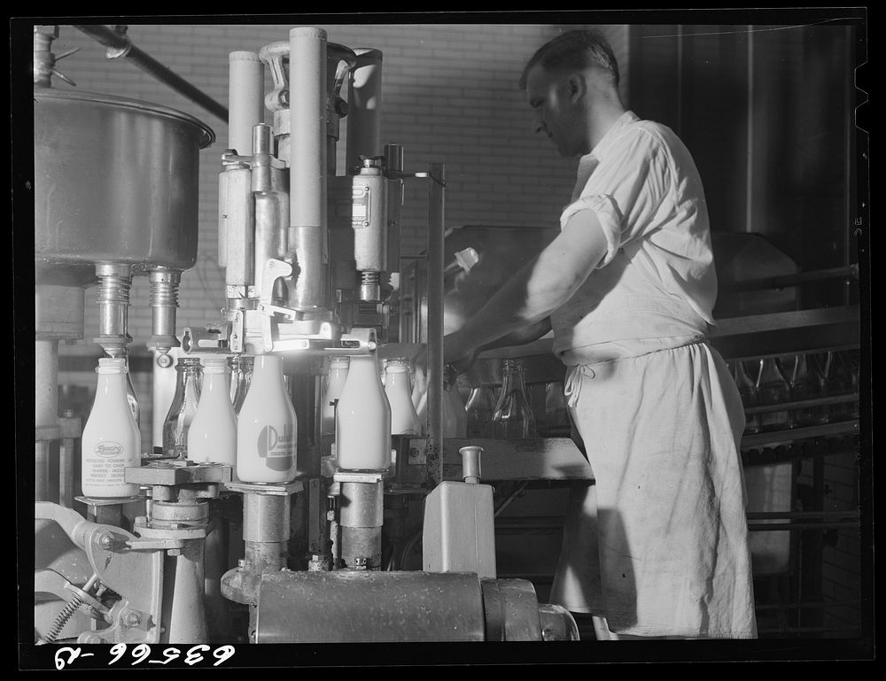 [Untitled photo, possibly related to: Bottling milk. Duluth Milk Company. Duluth, Minnesota]. Sourced from the Library of…