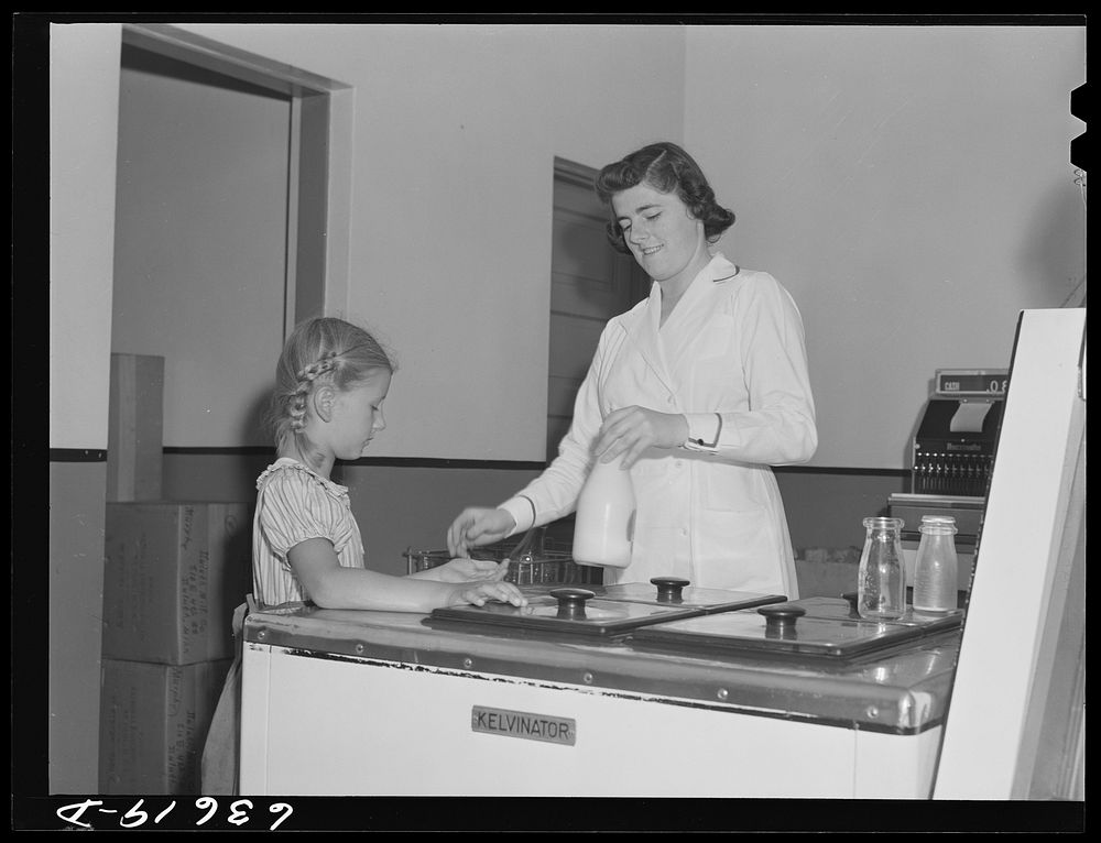 Child buying bottle of milk. Duluth Milk Company. Duluth, Minnesota. Sourced from the Library of Congress.