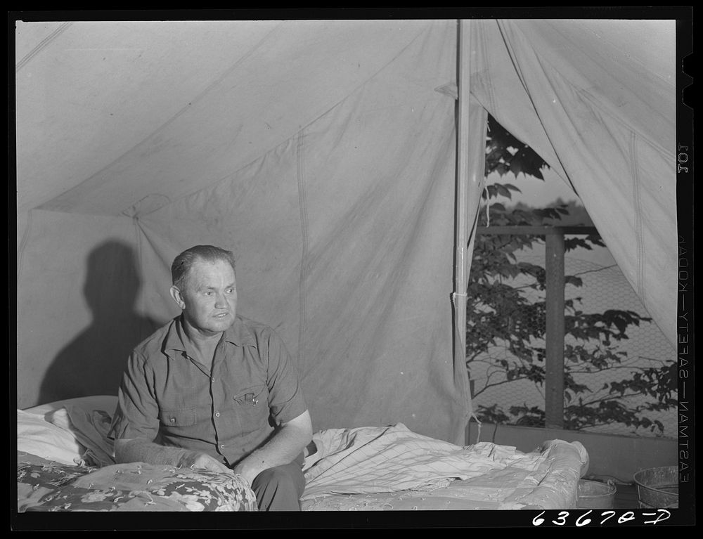 Mr. Akers, construction worker from Flint, Michigan now working at Ford bomber plant near Ypsilanti. He lives in a tent with…