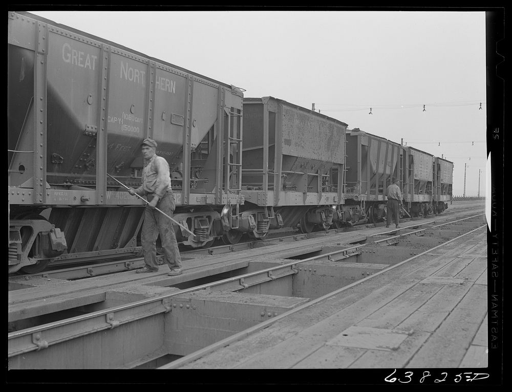 [Untitled photo, possibly related to: Cars of iron ore being emptied into bins on ore docks. Allouez, Wisconsin]. Sourced…