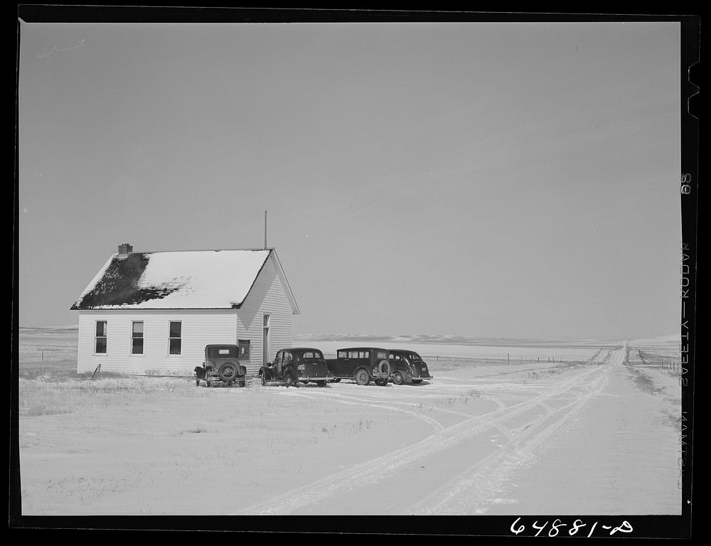 Adams County, North Dakota. Rural schoolhouse where farmers have come to attend Food for Victory meeting sponsored by the…