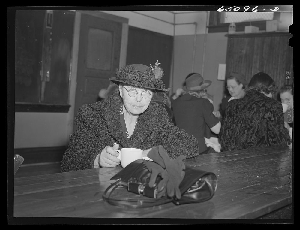 Epping, North Dakota. Lady having pie and coffee served by WCTU (Woman's Christian Temperance Union) after meeting held in…