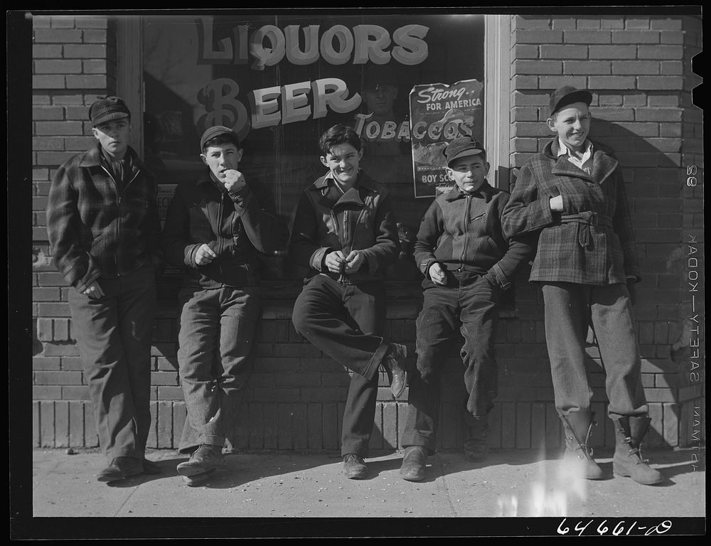 [Untitled photo, possibly related to: Roscoe, South Dakota. Younger boys are standing in front of the pool halls this year].…