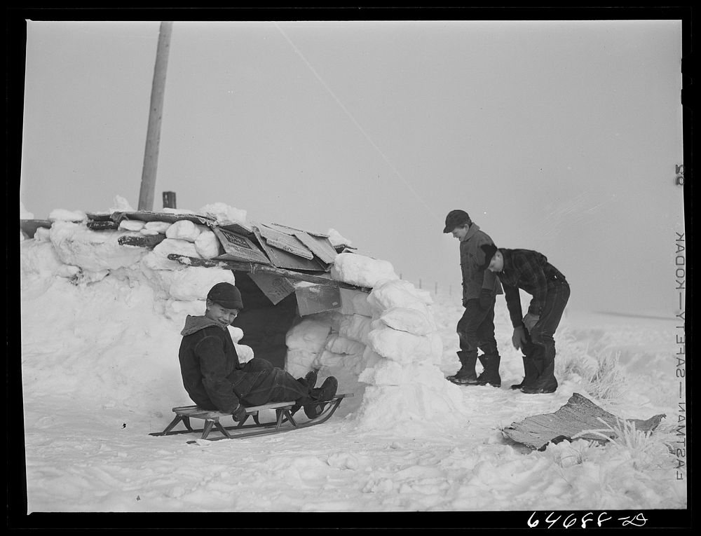 [Untitled photo, possibly related to: Morton County, North Dakota. Building snow fort at noon recess at a rural school].…