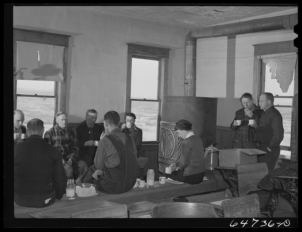 Adams County, North Dakota. Farmers brought their own lunch to an all-day Food for Victory meeting. Coffee was served by one…