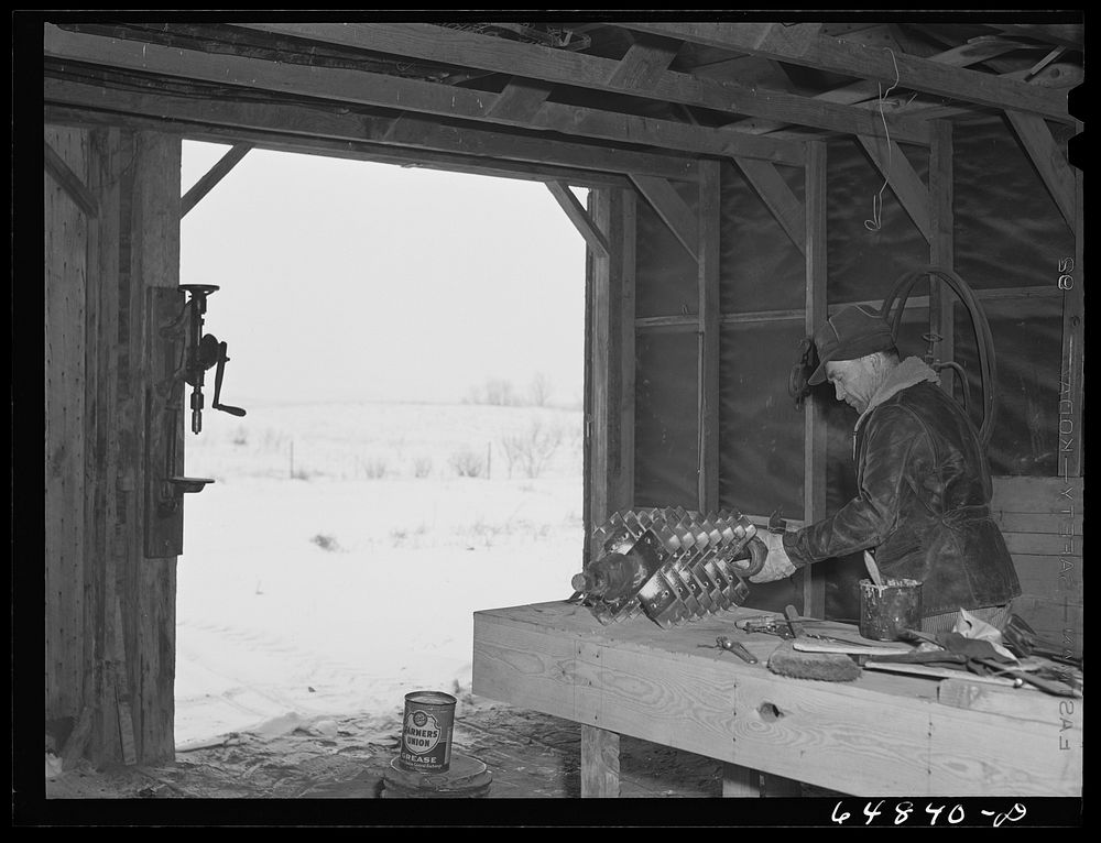 Adams County, North Dakota. Stock farmer, George P. Moeller, at work in his machine shed. Sourced from the Library of…