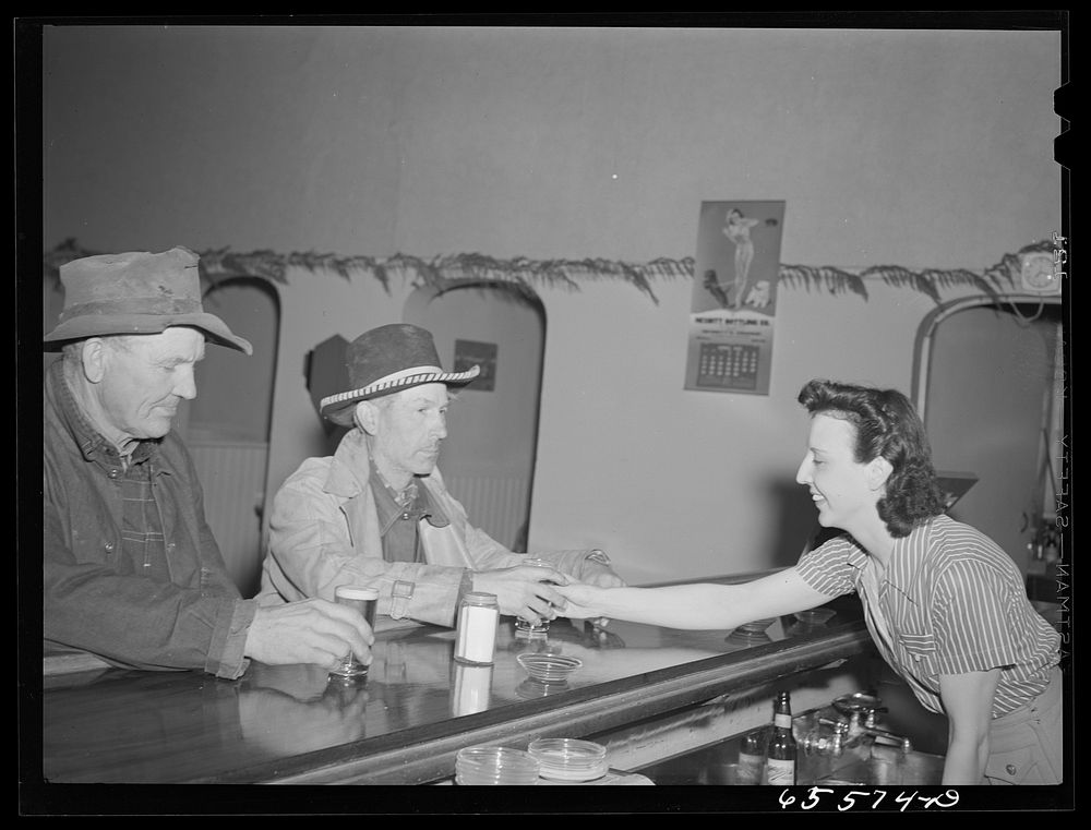 [Untitled photo, possibly related to: Hamilton, Montana. Sheep workers at the bar]. Sourced from the Library of Congress.