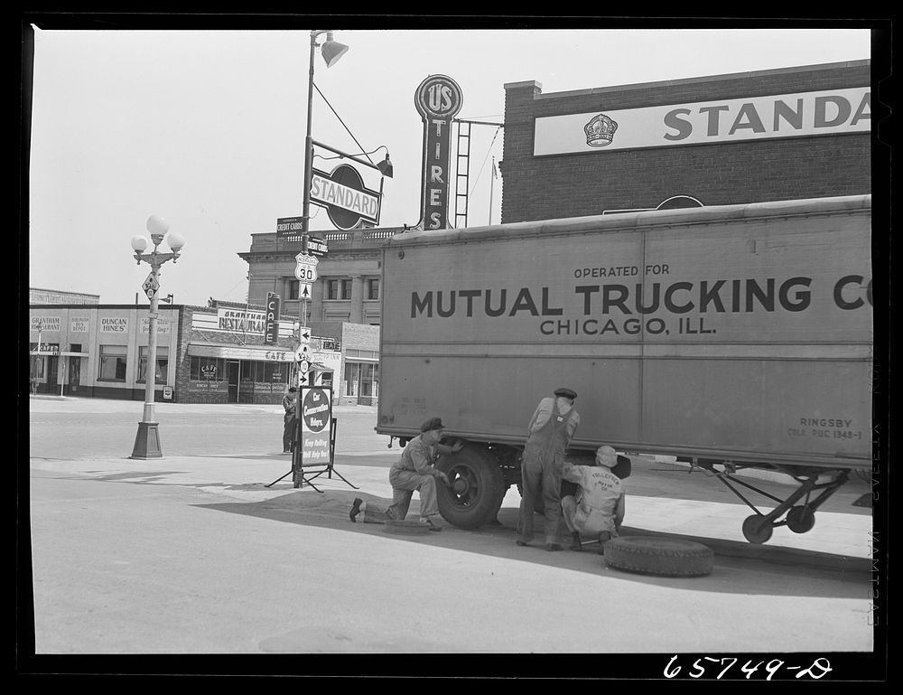 Kearney, Nebraska. Changing a tire on a trailer truck. Sourced from the Library of Congress.