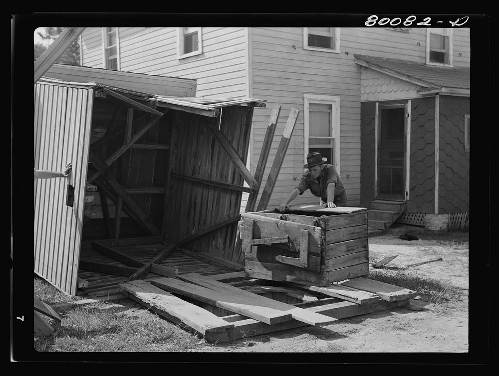 Removing the house and well cover. Safe well demonstration near La Plata, Maryland. Charles County. Sourced from the Library…