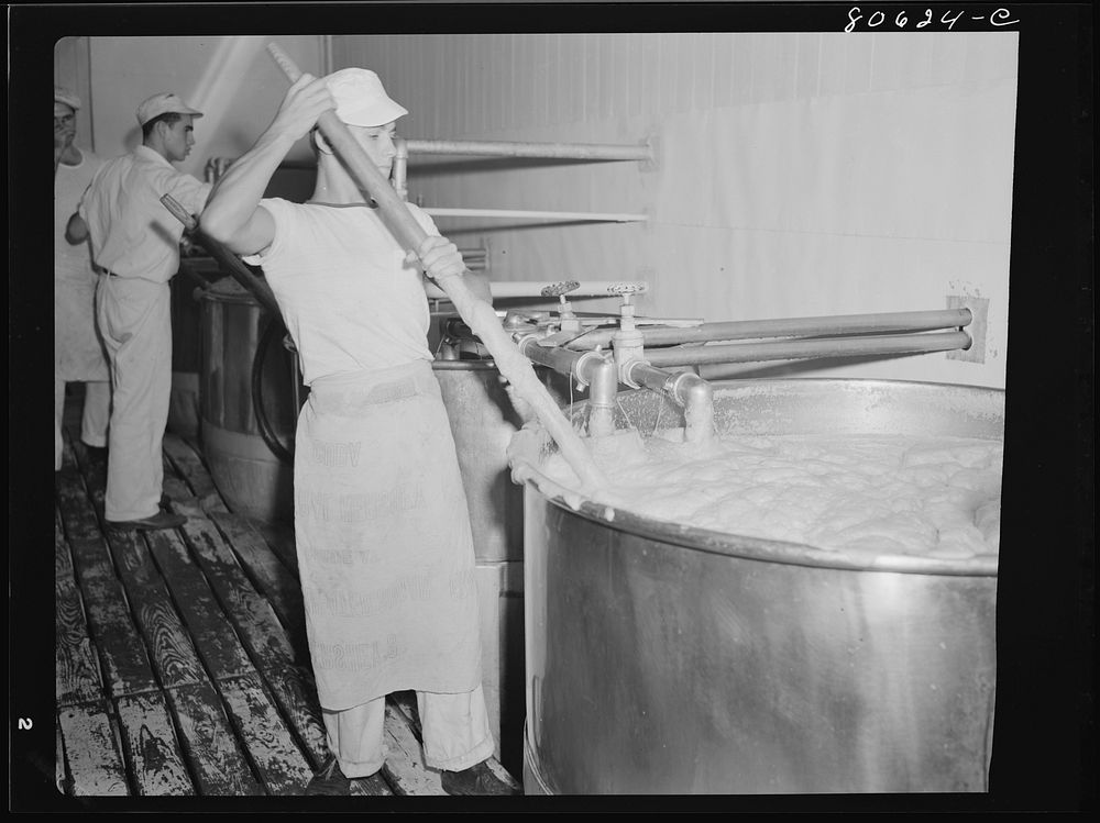 Tomato juice is boiled in open vats and then piped to the canning room. Phillips Cannery, Cambridge, Maryland. Sourced from…