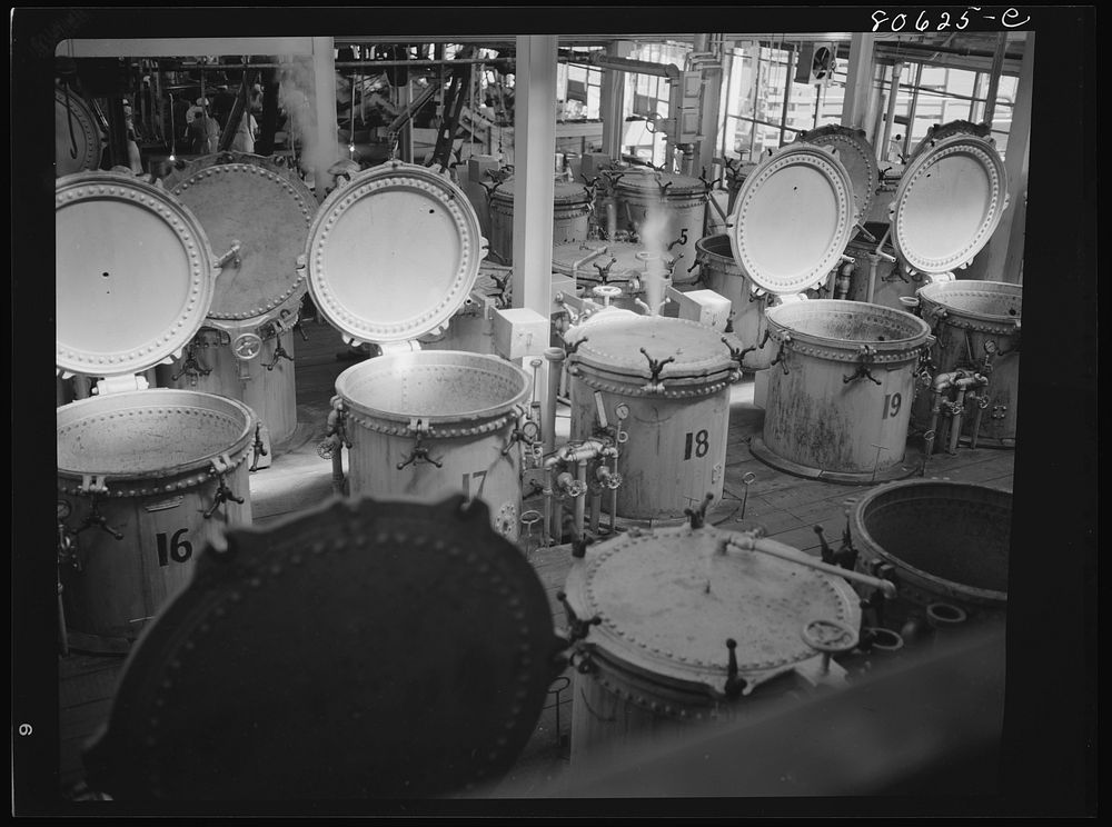 Vegetables are cooked after canning in these compressed steam vats. Phillips Cannery, Cambridge, Maryland. Sourced from the…